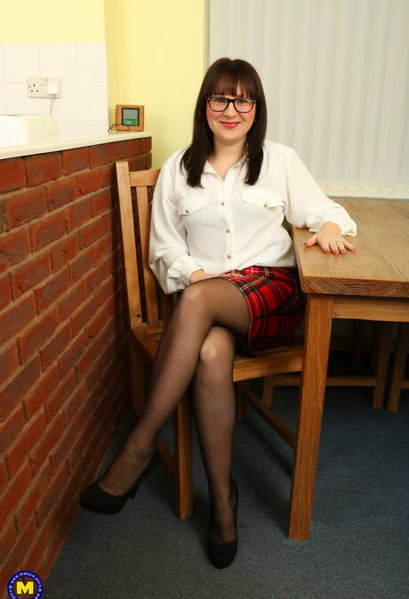 Mature NL xxx photo collection featuring sexy miss in scene with inserting a toy in twat